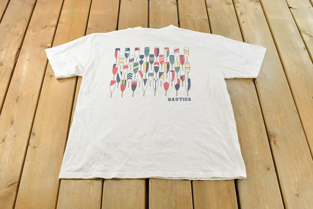 Vintage 1990s Nautica Rowing Oars Graphic T Shirt Men's L / Big Box Logo Print / 90s / Streetwear / Preppy / Made In USA / Single Stitch