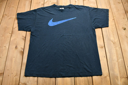 Vintage 1990s Distressed Nike Swoosh Graphic T-Shirt / 90s Streetwear / Vintage Athleisure / Made in USA / Vintage Athleticwear