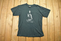 Vintage 1990s Black Metal Bounty Hunter Graphic T Shirt