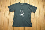 Vintage 1990s Black Metal Bounty Hunter Graphic T Shirt