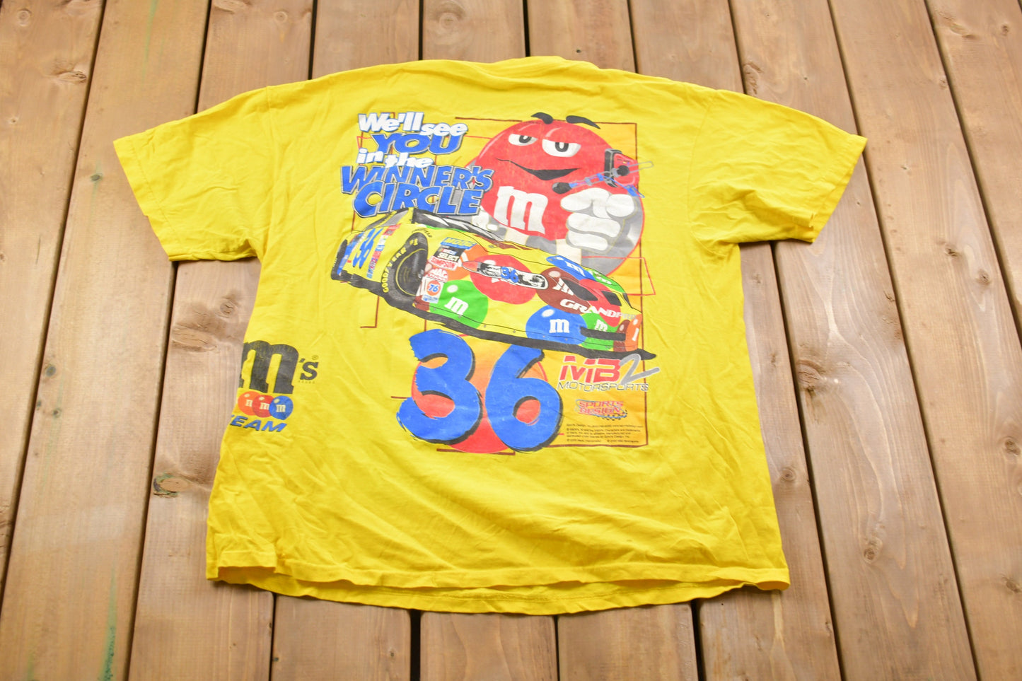 Vintage 1990s M&M All Over Print Racing Graphic T-Shirt