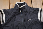 Vintage 1990s Kids Nike Swoosh Embroidered Windbreaker Jacket  Team Logo  Athletic Spring Summer Sportswear  Streetwear  Athleisure