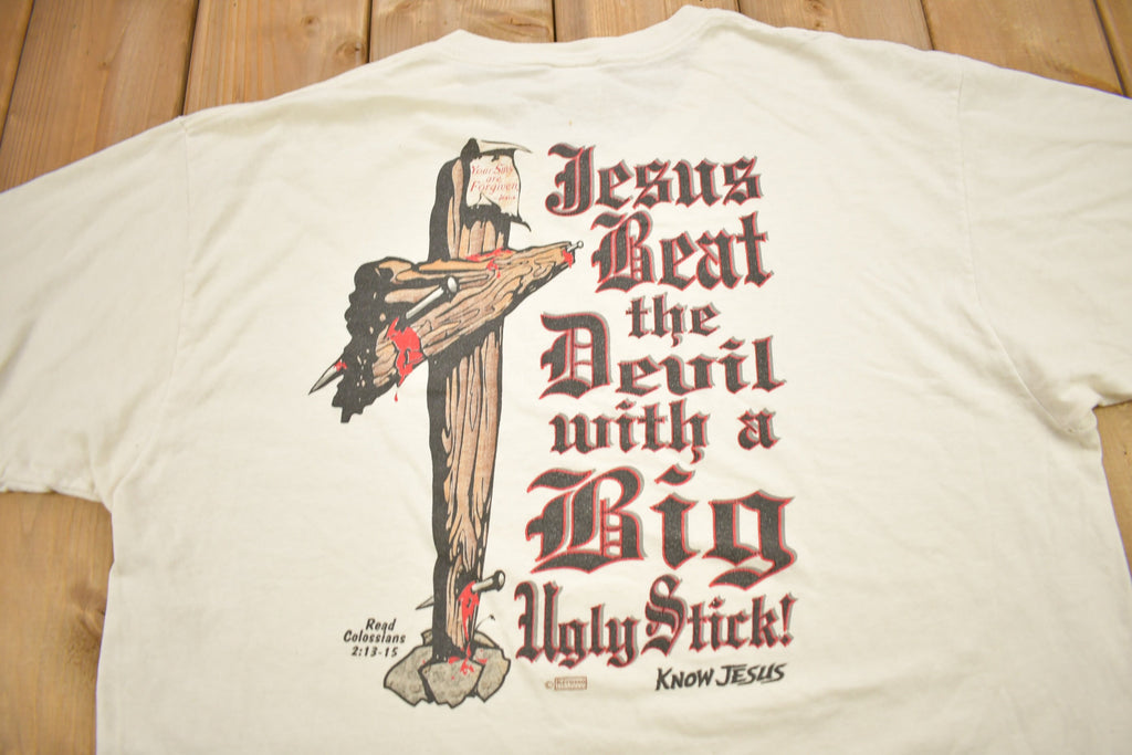Vintage 1990s "Jesus Beat The Devil With A Big Ugly Stick" Know Jesus Graphic T-Shirt