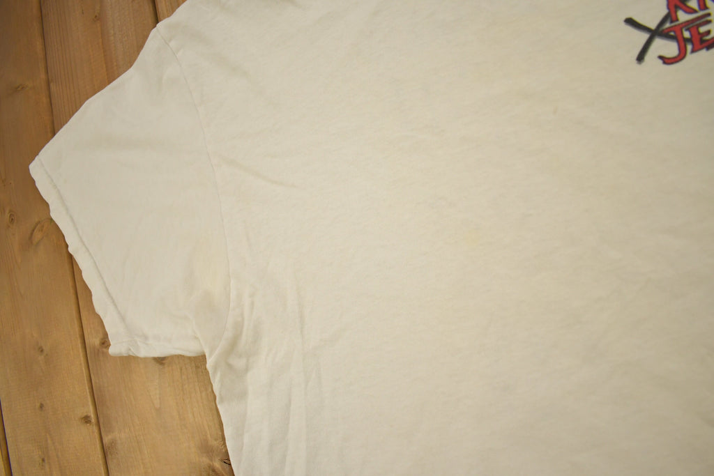 Vintage 1990s "Jesus Beat The Devil With A Big Ugly Stick" Know Jesus Graphic T-Shirt