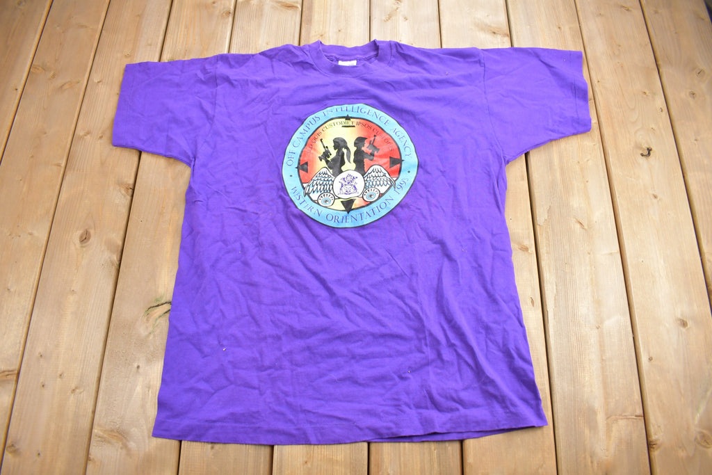Vintage 1990s Off Campus International Agency Western Orientation Graphic T Shirt