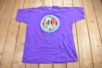 Vintage 1990s Off Campus International Agency Western Orientation Graphic T Shirt