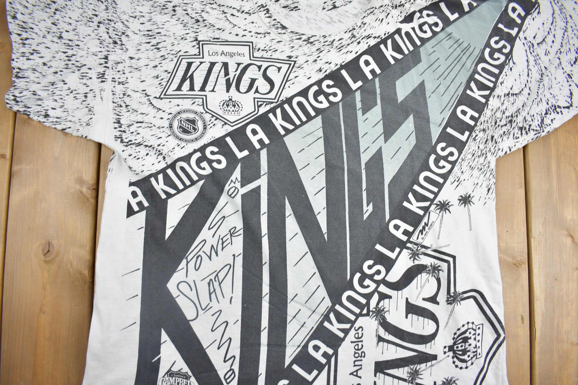 Vintage 1990s Los Angeles Kings NHL All Over Print Graphic T-Shirt