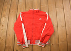 Vintage 1990s Nike Embroidered Mini Swoosh Zip-Up Jacket