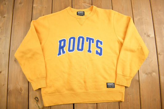 Vintage 1990s Roots Yellow Spellout Crewneck Sweatshirt / 90s Crewneck / Made In Canada / Streetwear / Embroidered