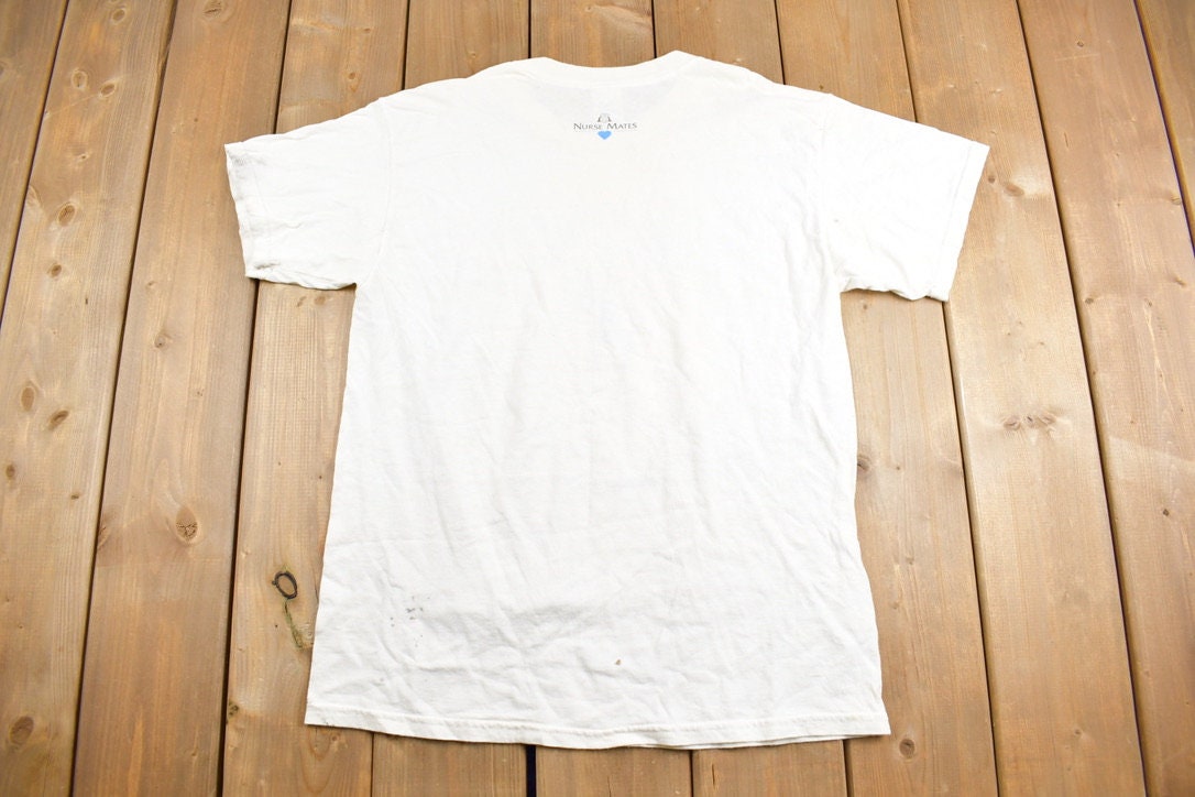 Vintage 1990s Nurse Mates Managed Care Graphic T-Shirt