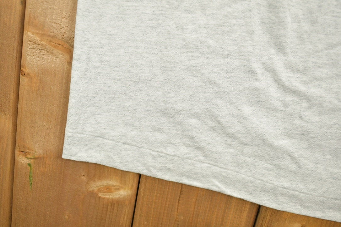 Vintage 1990s Ogilvy Renault Law Firm Graphic T-Shirt