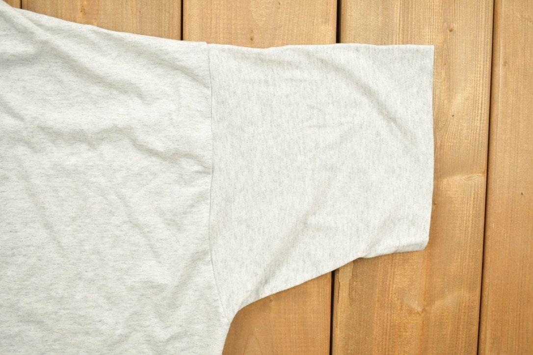 Vintage 1990s Ogilvy Renault Law Firm Graphic T-Shirt