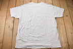 Vintage 1990s  Looney Tunes Hockey Graphic T-Shirt
