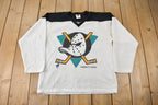 Vintage 1990s Anaheim Mighty Ducks NHL Ravens Hockey Jersey Made In Canada Size Youth Large