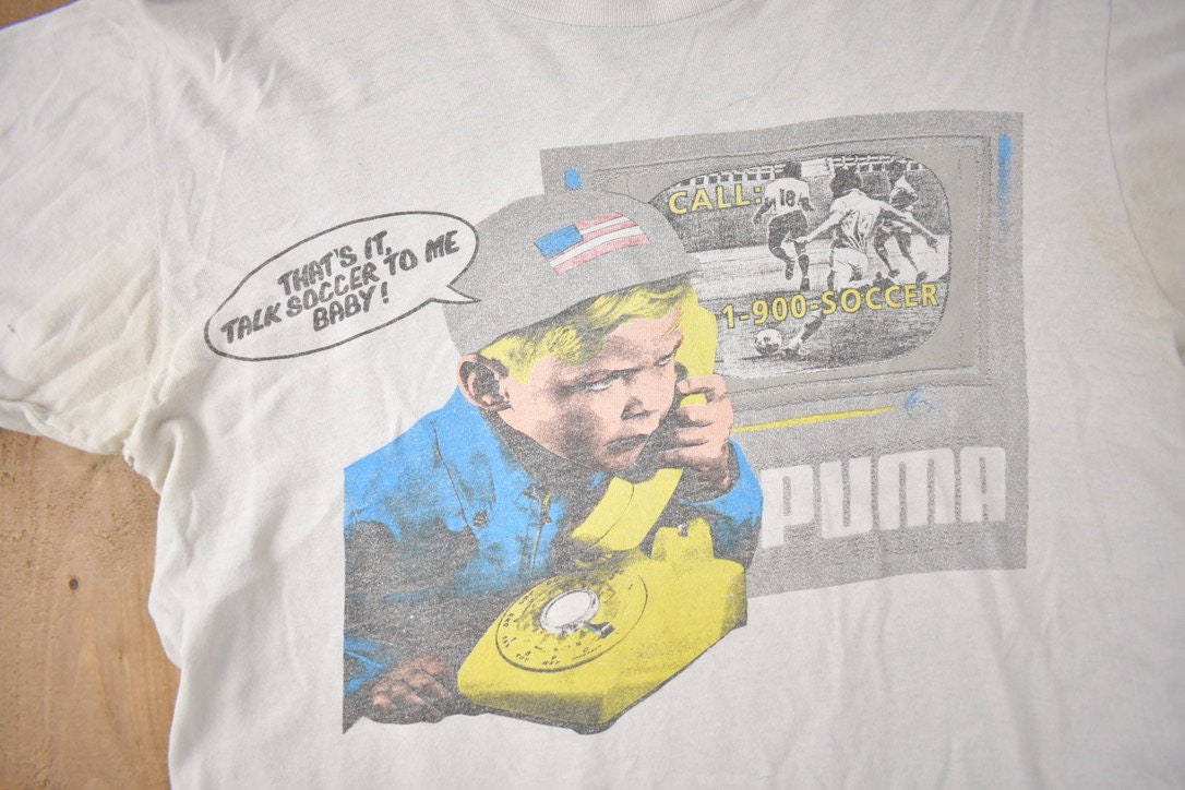 Vintage 1990s Puma Soccer Baby Graphic T Shirt Made In USA Size Medium