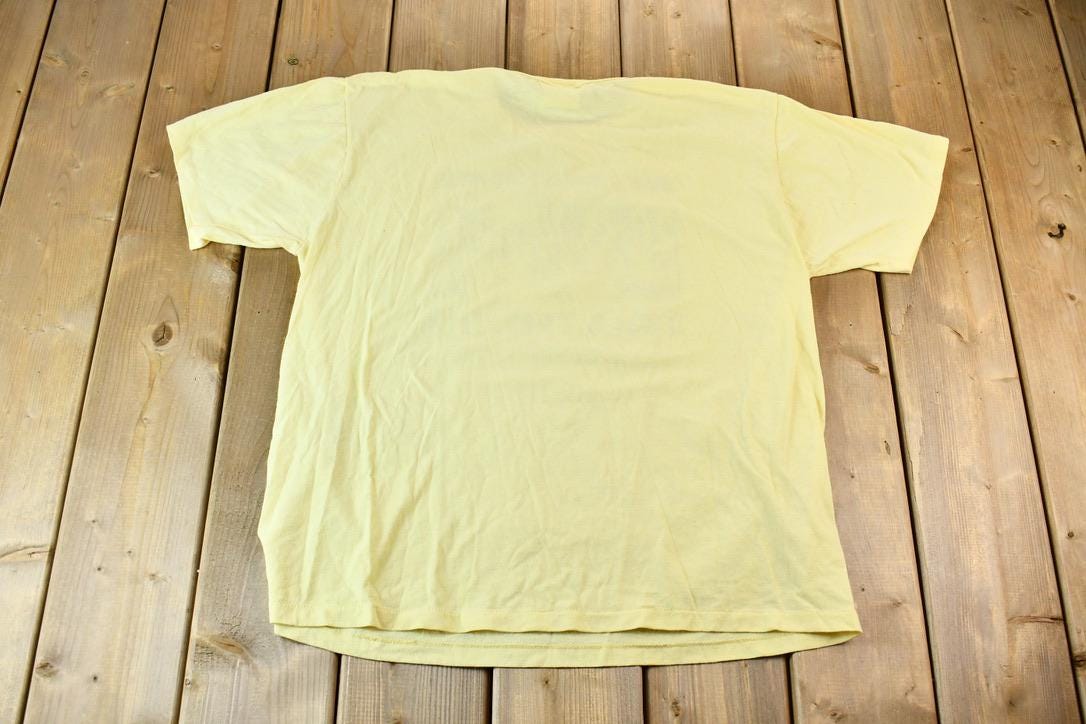 Vintage 1990s Light Yellow Penmans CFB Gagetown Short Course Triathlon Single Stitch Graphic T-Shirt