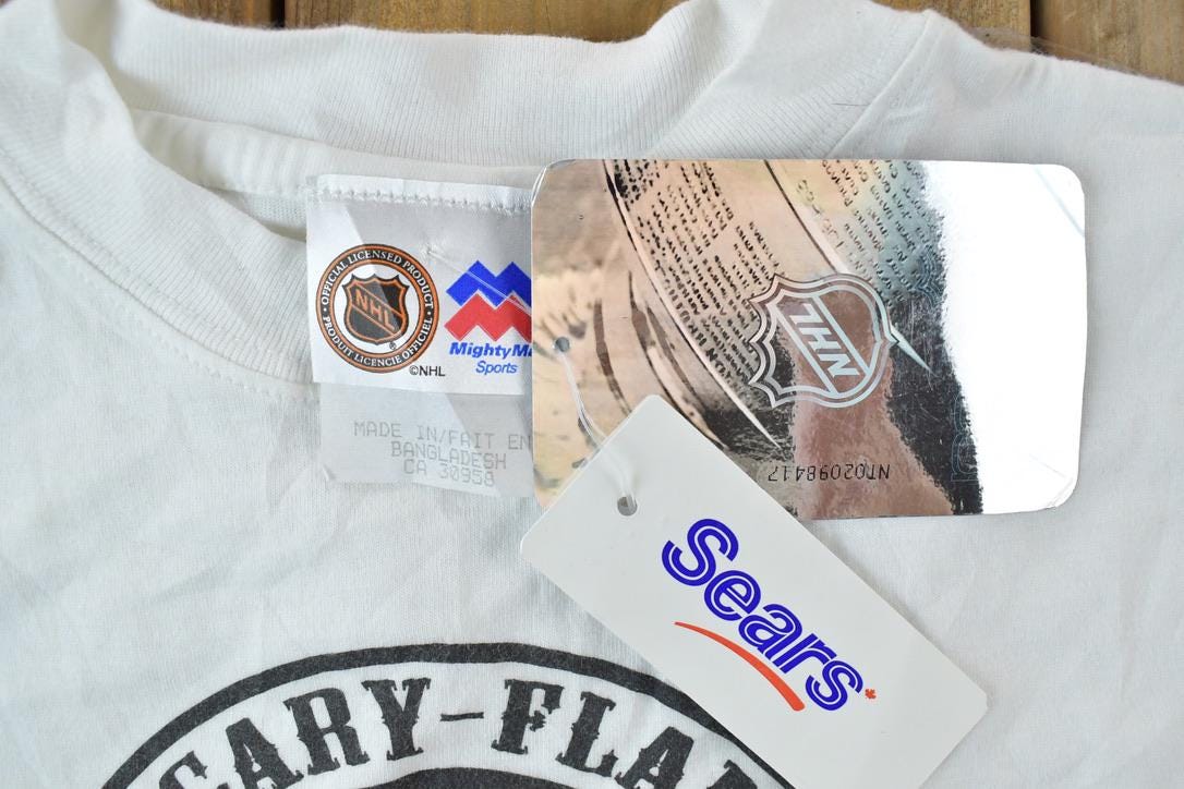 Vintage 1990s Deadstock Youth Calgary Flames NHL Graphic T-Shirt