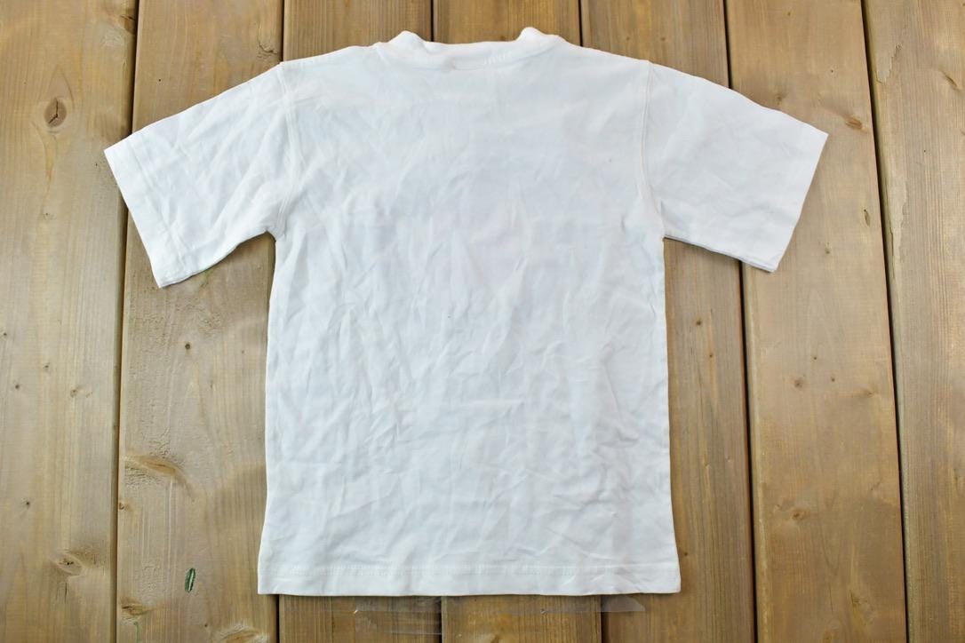 Vintage 1990s Deadstock Youth Calgary Flames NHL Graphic T-Shirt